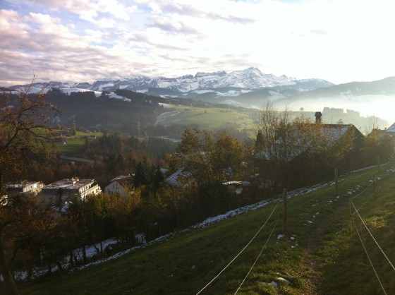 Day hiking in Switzerland after the first snow = muddy.  Walking through the cow pastures = interesting smells.  View of the Alps = priceless